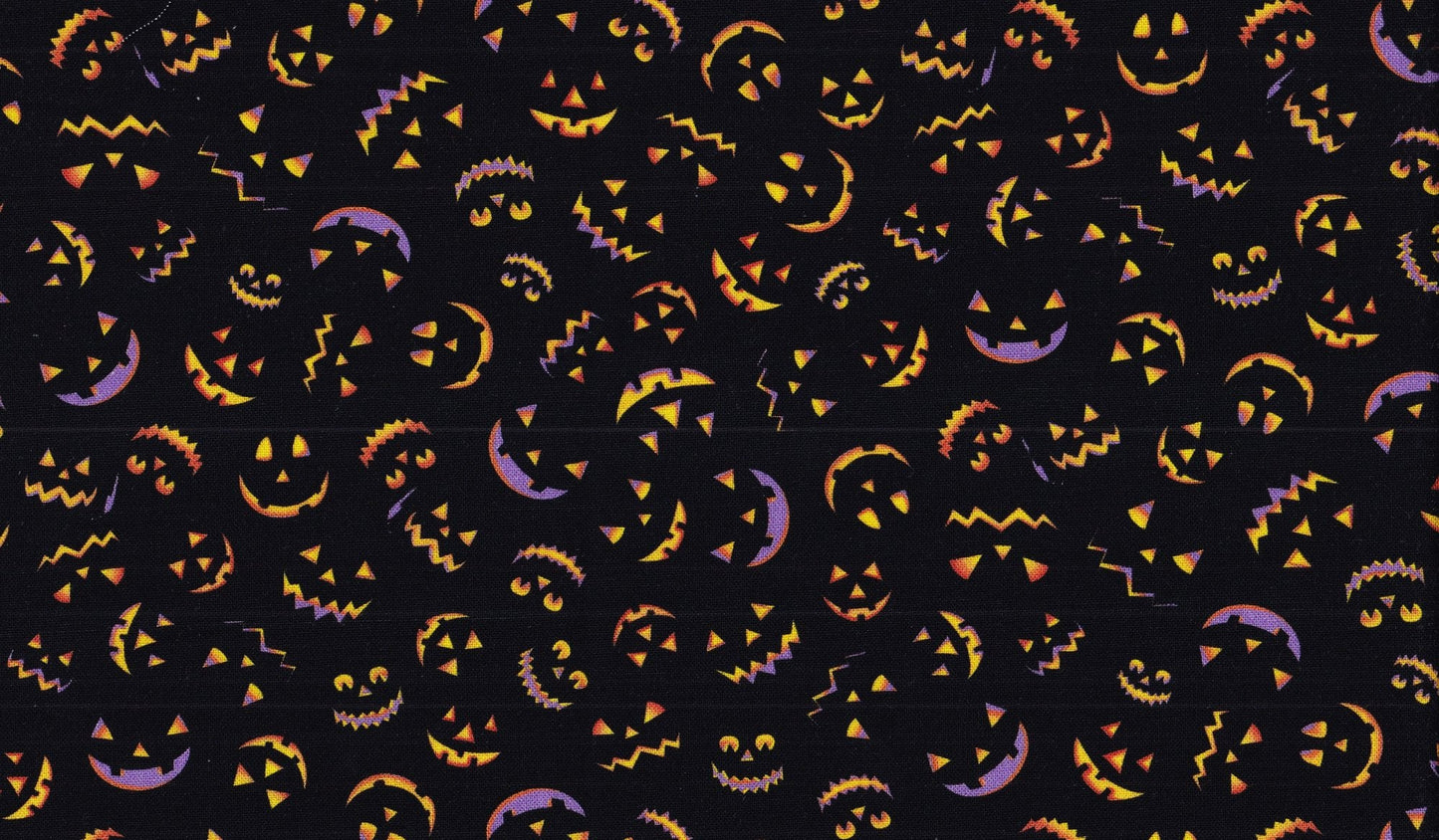 A piece of Halloween-themed cotton fabric featuring a pattern with MINI pumpkins on a black background.