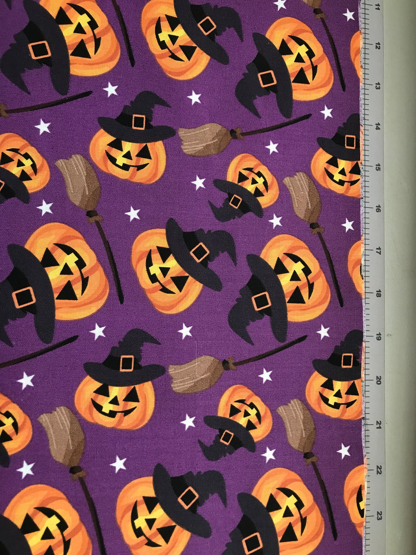 45 x 36 Halloween Smiling Pumpkins and Witches Brooms on Purple 100% Cotton Fabric