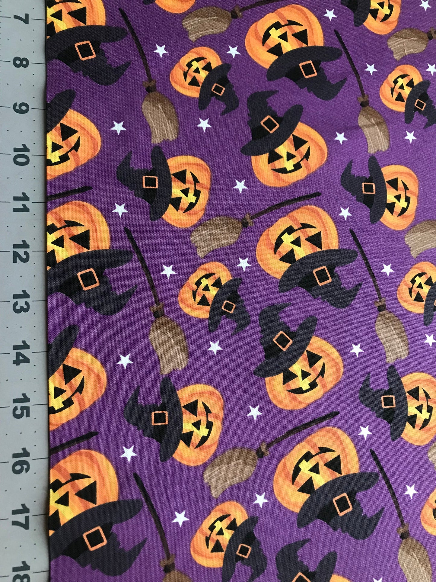 45 x 36 Halloween Smiling Pumpkins and Witches Brooms on Purple 100% Cotton Fabric