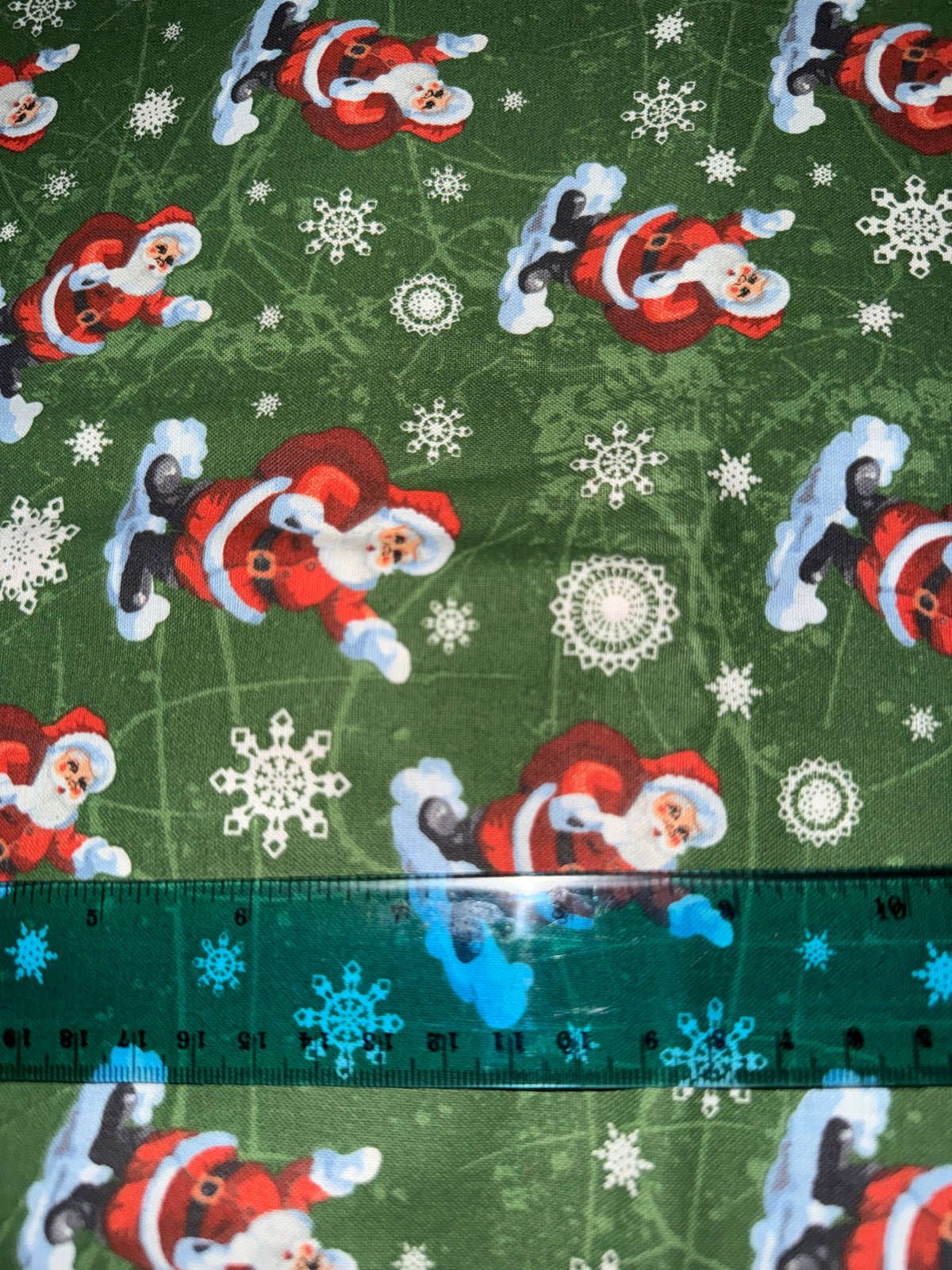 Christmas Santa on Clouds Snowflakes on Green 100% Cotton Fabric