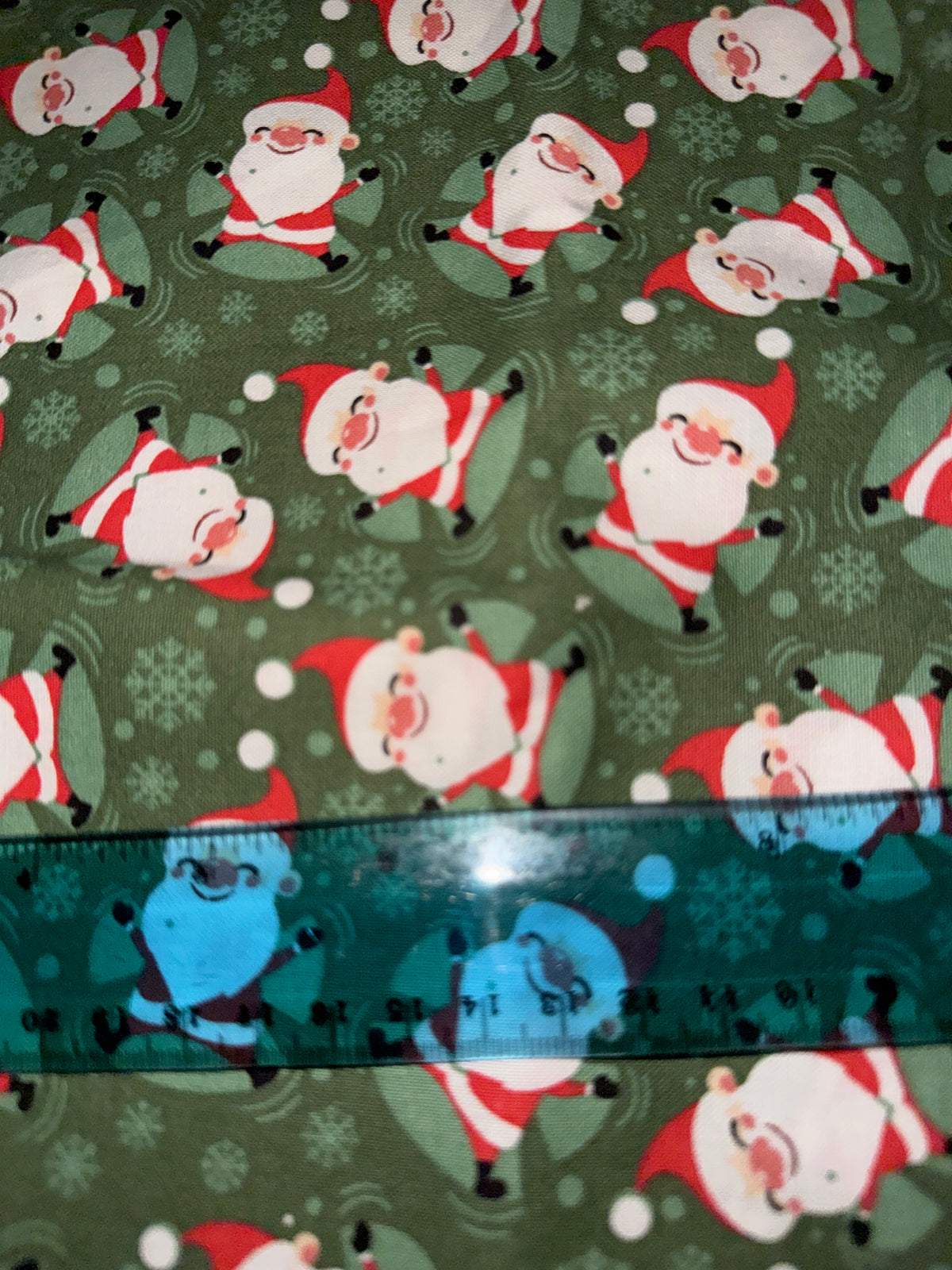 Christmas Santa making Snow Angels on Green 100% Cotton Fabric