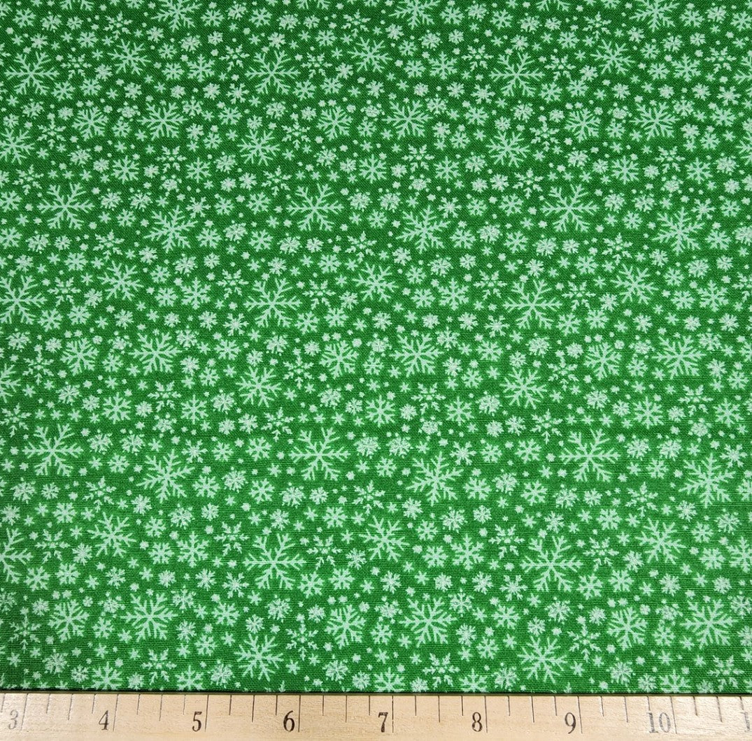 45 x 36 Christmas Various Size Snowflakes on Green 100% Cotton Fabric