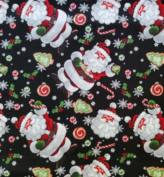 Christmas-themed fabric with Santa Claus, cookies, and candy on a black background