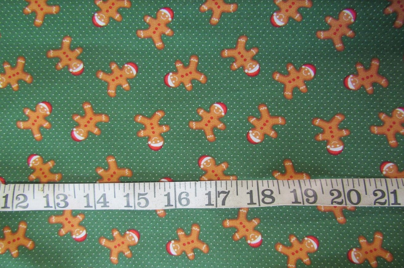 Christmas Fabric Happy Gingerbread Men with Santa Hats on Green Dots by the yard